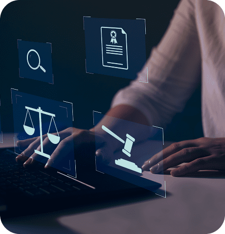 Person using laptop with legal symbols hologram.