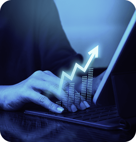 Person typing with rising graph overlay.