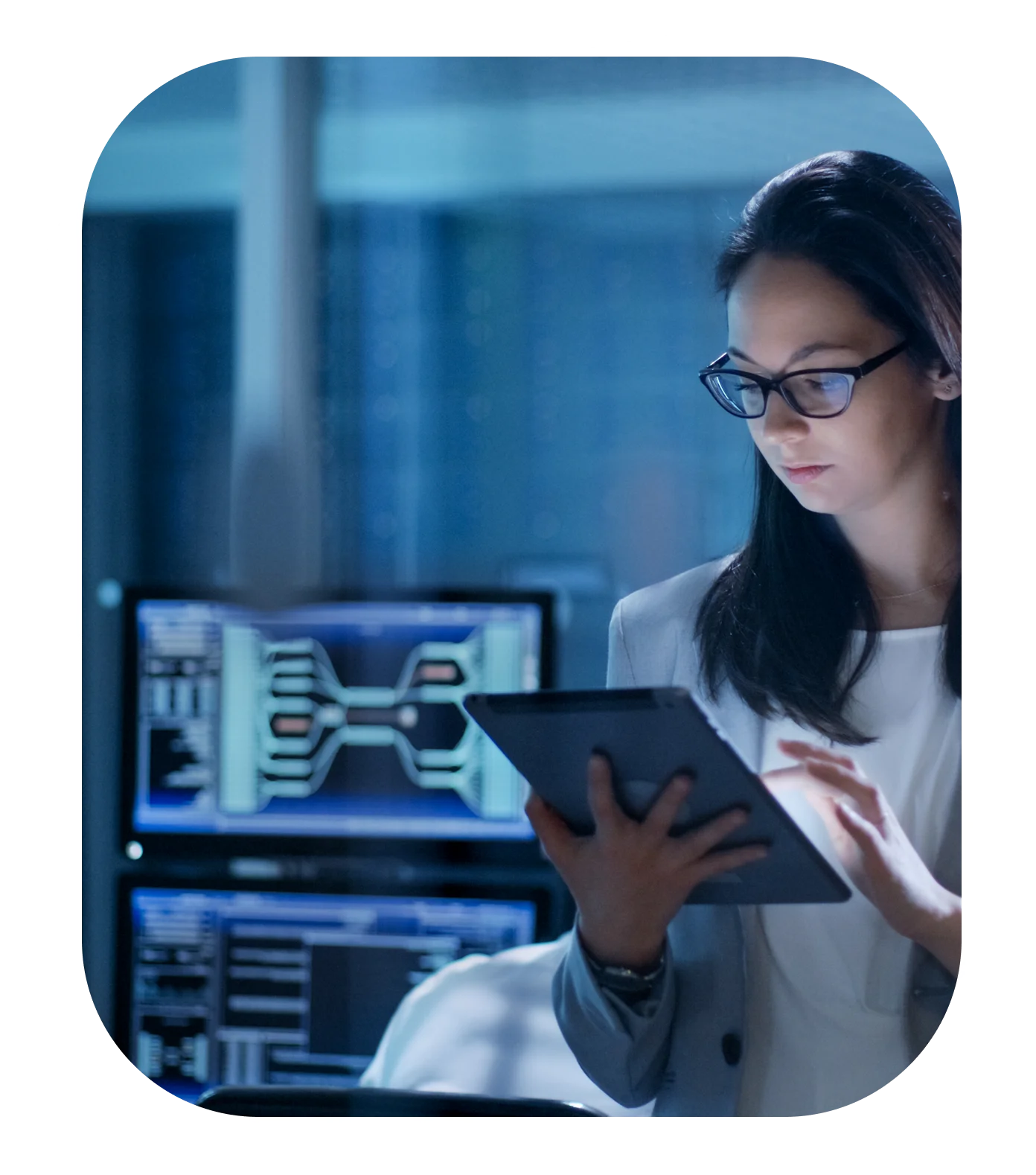 Woman using tablet in tech office.